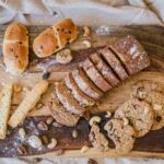 Cookies and Sliced Bread on Brown Wooden Chopping Board