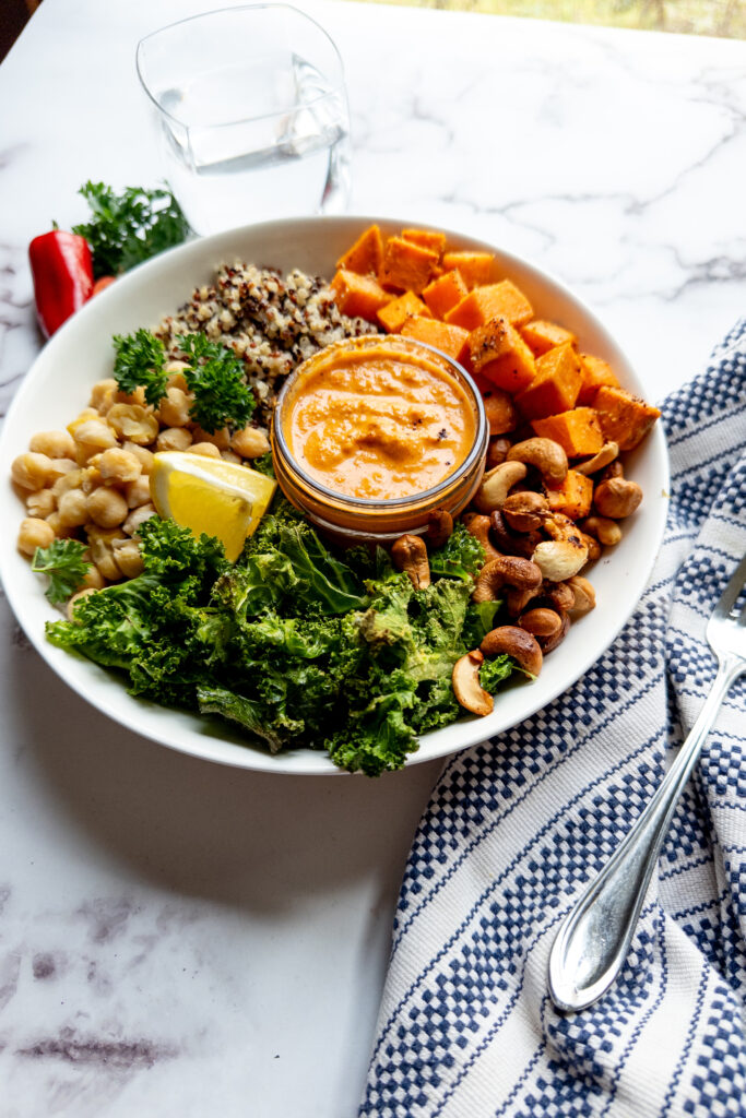 Mediterranean chickpea and quinoa bowl with roasted red pepper sauce