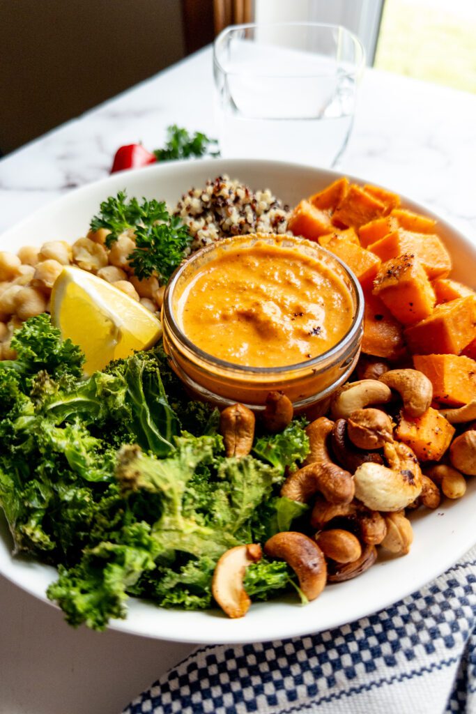 Mediterranean chickpea and quinoa bowl with roasted red pepper sauce