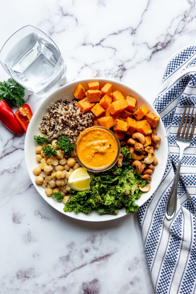 Mediterranean chickpea and quinoa bowl with roasted red pepper sauce