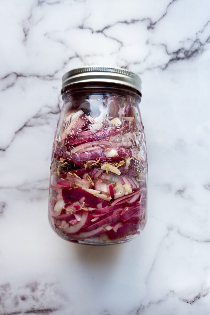 pickled red onions in a jar